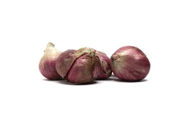 A close-up of Four pieces red onions on a white background. The onions are slightly different in size and have a few dry outer layers.