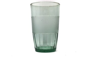 The photo shows a glass that has a frosted band around the middle and a ribbed green base.
