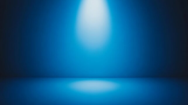 Vivid blue spotlight illuminates a dark background, captivating display of light and shadow