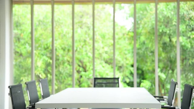 Office meeting board room no people Empty with eco green view natural. Conference room office for shareholder team. White wood table black chair funiture green background. 