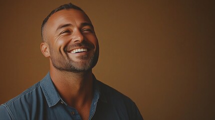 Fototapeta premium Portrait of a happy handsome man in a shirt with laughing