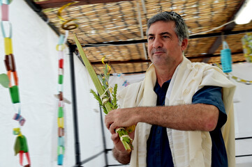 Jewish man blessing on the four species on the Jewish holiday of Sukkot