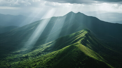 Breathtaking rays of sunlight illuminate lush green hills, creating serene and tranquil atmosphere. rolling landscape showcases natures beauty and majesty