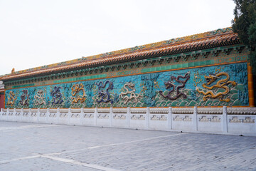 Obraz premium Chinese glazed tile dragon sculpture，Kowloon Wall in Beihai Park, China，The nine dragon walls of beihai park