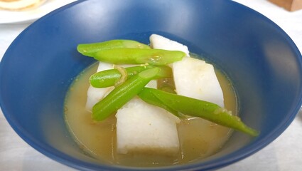 breakfast with a bowl of lontong sayur.