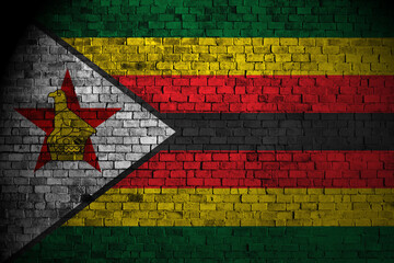zimbabwe flag on a brick wall.