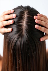 Fototapeta premium Intimate Close-Up of Dark Brown Hair: A Detailed Exploration of Scalp, Hair Parting, and Roots for Hair Care Enthusiasts