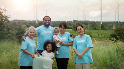 A group of people wearing blue shirts with the word 