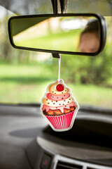 Cupcake Shaped Car Freshener Hanging On Back View Mirror Inside Car