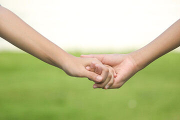 Close up of diverse couple holding hands,free time and vacation.