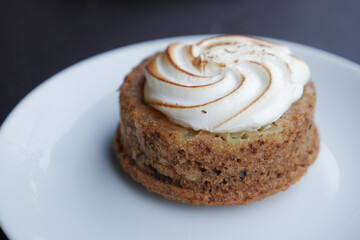 Deliciously Baked Dessert with a Fluffy Whipped Topping Generously Placed on a Plate