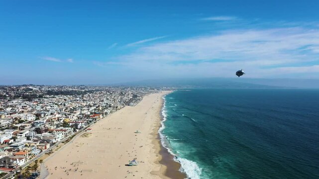 Distant View Of the Goodyear Blimp Over Manhattan Beach In California, USA. Aerial Shot