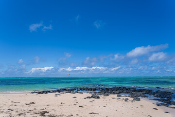 Visitors experience the thrill of paragliding in the beautiful lagoon of Ile Aux Cerfs, Mauritius. Visitors can glide effortlessly on the calm waters, surrounded by stunning scenery.