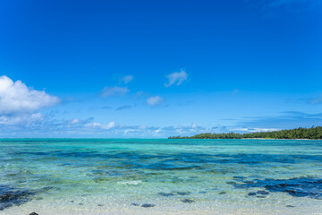 Visitors experience the thrill of paragliding in the beautiful lagoon of Ile Aux Cerfs, Mauritius. Visitors can glide effortlessly on the calm waters, surrounded by stunning scenery.