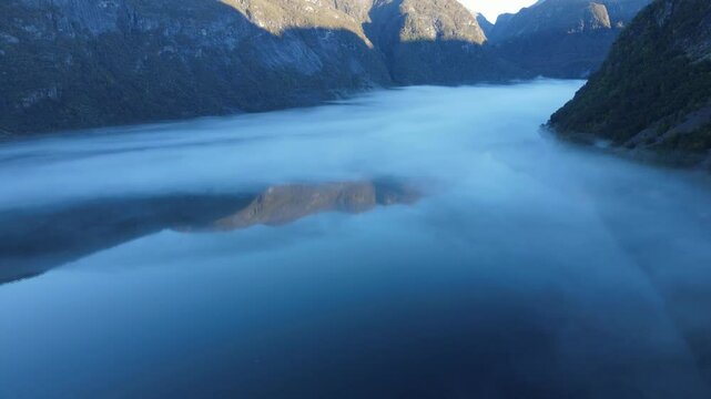Reflection of Mountains in Hardanger fjord in Norway. Drone footage