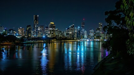 Obraz premium Capture the skyline at night, with lights from the buildings creating a vibrant cityscape.