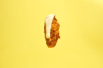 Naklejka premium Hot Buffalo Chicken Wing Flat with Ranch Isolated on Yellow Background