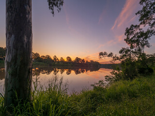 Sunset by the River with Reflections