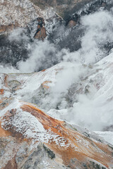 Steam hot springs and snow scene in Noboribetsu Hell Valley, Hokkaido, Japan