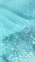 Oil water drop. Bubble liquid. Defocused clear blue color fluid swirl wet gloss texture flow...