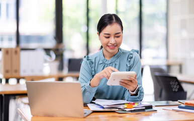 asian business woman or auditor examining documents,Professional scrutinizes financial documents...