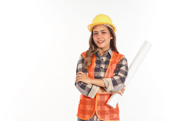 smiling cheerfully young asian female architect wearing helmet while holding roll of paper with arm crossed
