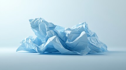 Obraz premium Crumpled blue paper ball on white background, texture and abstract concept 