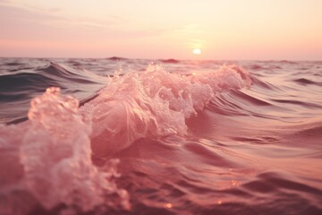 Fototapeta premium Mesmerizing ocean waves gently rolling beneath a breathtaking pink sunset sky at dusk