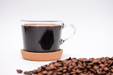 White background with a pile of coffee beans on it