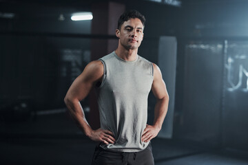 Gym, exercise and portrait of man with confidence, pride and commitment to healthy body workout. Bodybuilder, athlete or serious face of boxer at mma club for fitness, training and sports membership