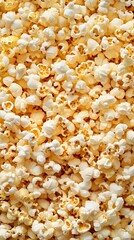 A close-up view of a large pile of buttery popcorn, perfect for snacking.