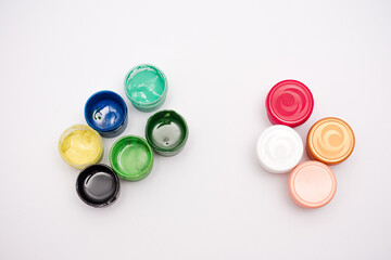 A row of paint containers with different colors