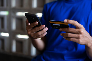 hands holding cell phones and credit cards, the concept of online transactions