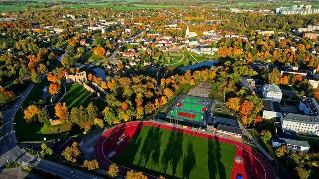 Aerial View of Dobele Castle, Sports Complex, and City Landscape in Autumn Season