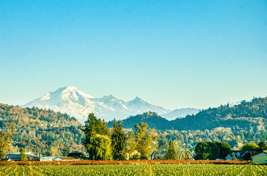 Spectacular view of Fraser Valley countryside around Chilliwack, BC, Canada. Snow covere d peaks of Mt. Baker visible in the background