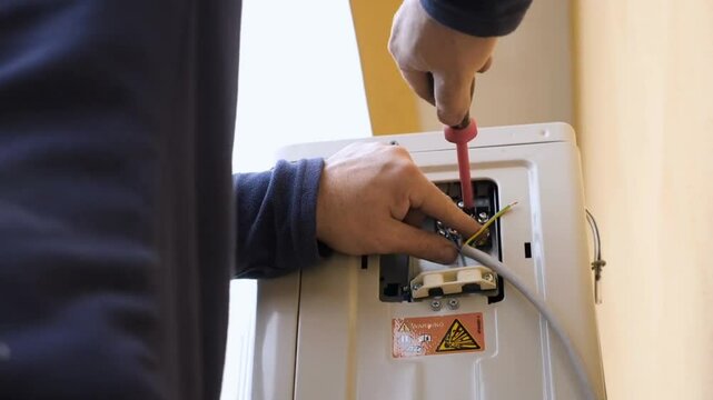 AC Electrician Technician Repairing Air Conditioner Appliance