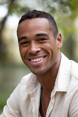 Obraz premium Happy African American man smiling outdoors, portrait