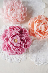 Handmade wax candle in the shape of a pink peony flower