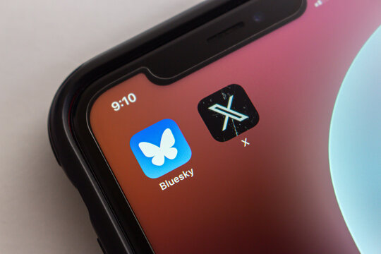 Mexico City, MEXICO - Oct 22 2024 : Bluesky Social and X app are displayed in an iPhone screen.