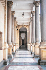 Beautiful and scenic postcard view of a corridor at the Mill Colonnade (Mlýnská Kolonáda) in...
