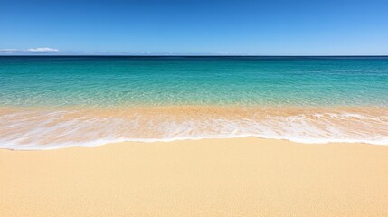 Fototapeta premium A tranquil beach scene featuring soft, golden sand meeting clear turquoise waters under a bright blue sky.