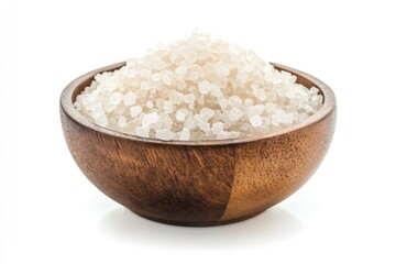 A bowl filled with white sea salt on a natural wood background