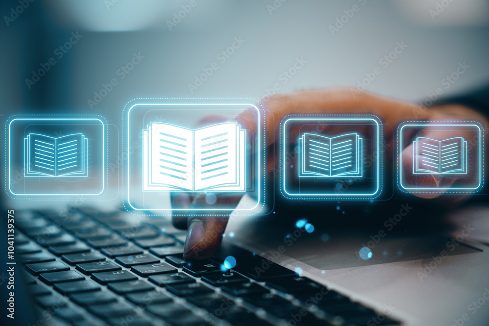 Poster close up of hand using laptop keyboard with creative e-book hologram on blurry background. e-library
