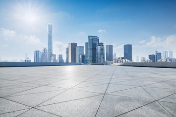 Empty square floor and city skyline with modern buildings scenery in Shenzhen. car advertising background.