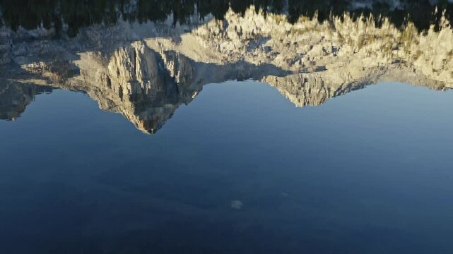 Clear mountain reflection on Rae Lakes with deep blue water along the John Muir Trail in California