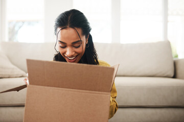 Home, woman or happy with box for opening, shipment or delivery product in living room with smile. House, female person or excited with package for surprise, present or cardboard for parcel in lounge