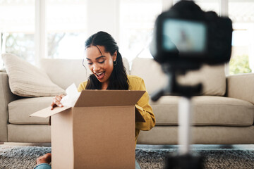 Home, happy woman and video with camera for box, package or product review for paid partnership....
