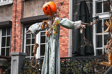 Naklejka premium Scarecrow with evil pumpkin head. Jack O'Lantern