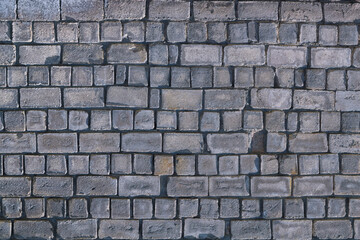 Obraz premium Old gray cement background with cinder block wall.