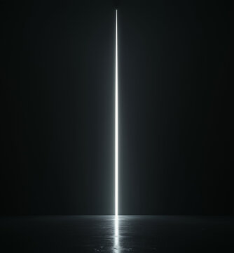 A single thin white light beam shines down in the darkness